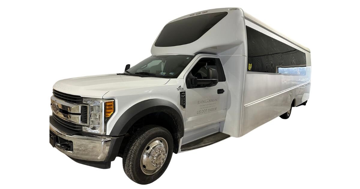 Jimmys Limo white limousine-bus-37outside rental transport